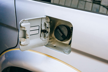 Oil filler cap opening at the gas station