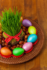 Fototapeta na wymiar Colored eggs, wheat springs Nowruz Holiday in Azerbaijan. Selective focus.