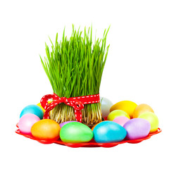 Colored eggs, wheat springs on Nowruz holiday on white background. Selective focus.