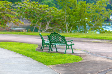 Fototapeta na wymiar empty metal green benches in the Park