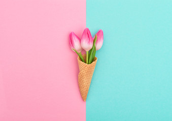 Tulips ice cream waffle cone Pink flowers flat lay Minimal