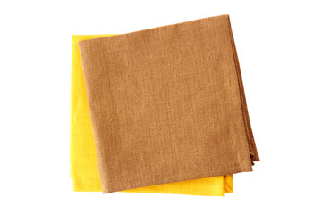 Two colorful napkins, yellow and brown, on white