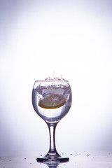 slice of lemon drops in a glass of water