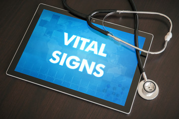 Vital signs (cardiology related) diagnosis medical concept on tablet screen with stethoscope