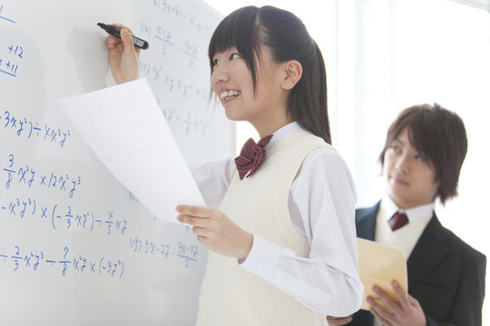 Teenage Girl Writing on Whiteboard