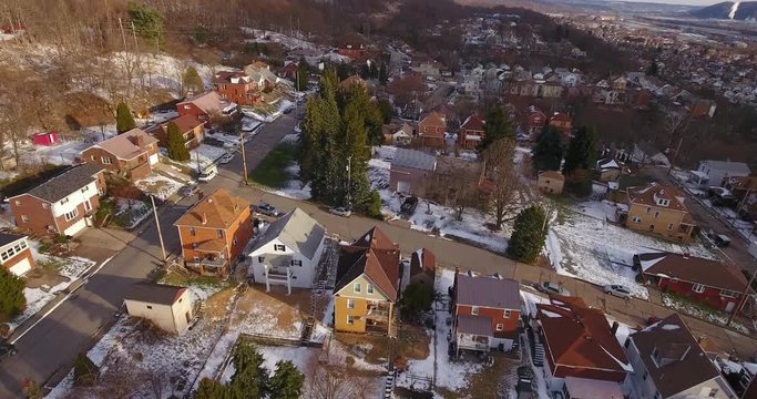 A slowly moving forward aerial winter view of a typical Western Pennsylvania residential neighborhood.	 	