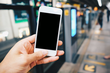 Smartphone black screen in hand at train station