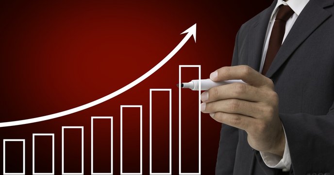 Businessman Drawing Upward Trend Graph With Marker