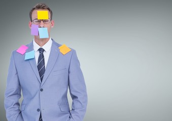 Stressed businessman covered by sticky notes