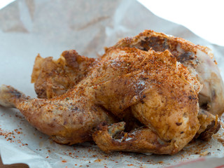 Whole roast grilled chicken on apaper