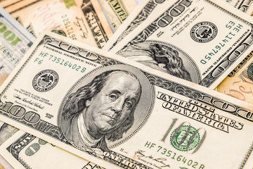 10 and 100 us dollar banknote close up