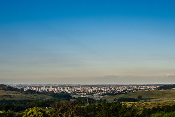 Panoramic view on the city of Tandil in Argentina from the hill. Landscape and cityscape.