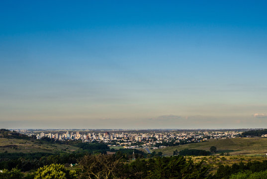 Panoramic view on the city of Tandil in Argentina from the hill. Landscape and cityscape.