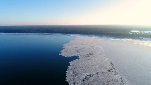 13048_Aerial_shot_of_the_frozen_sea_in_Laheema.mov