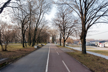 Fototapeta premium Park and pedestrian zone on the bank of Danube river, in the new part of the city