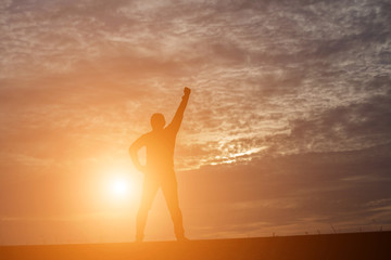 Man show hands silhouette sunset background