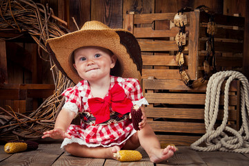 Cheerful girl child dressed in country style.