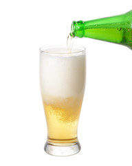 Pouring cold beer in glass isolated on a white background.