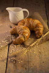Freshly baked croissants on the dark background.