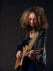 Woman playing the guitar