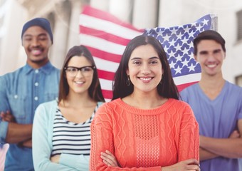 Colleagues standing with their arms crossed