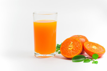 Orange juice pour in a glass and the orange effect placed on the side on white background