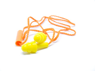 Close-up orange ear plugs on white background.