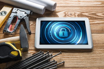 Web security and technology concept with tablet pc on wooden table © adam121