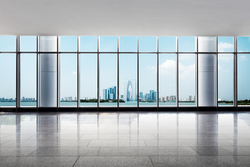Obraz na płótnie Canvas empty floor and cityscape of modern city from window