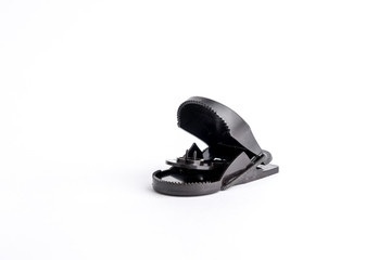 Mousetrap black in plastic and metal on a white background