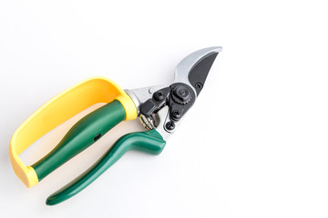 Green garden secateur with arm protection yellow, on white background