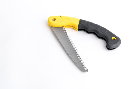 Folding garden hacksaw black-yellow saw on white background, saw with handle lock