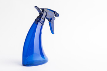 Small liquid atomizer of different colors on a white background, blue sprayer