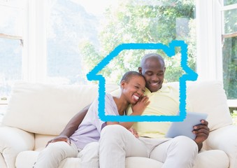 Home outline with couple using digital tablet at home