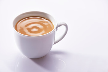Coffee cream in a white cup on white background
