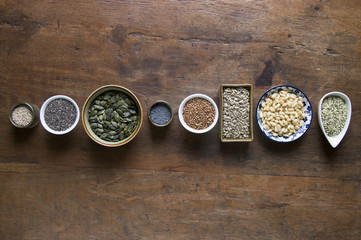 Seeds and herbs in bowls top view