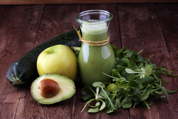 Healthy green smoothie and ingredients - superfoods, detox, diet, health, vegetarian food concept