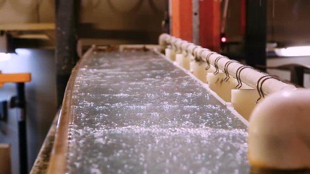 Capacity for anodizing aluminum products. Manufacture. Chemical processes. Close-up.
