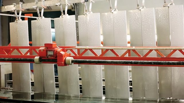 Process of anodizing aluminum products  in production, automatic production line. Manufacture. Close-Up.
