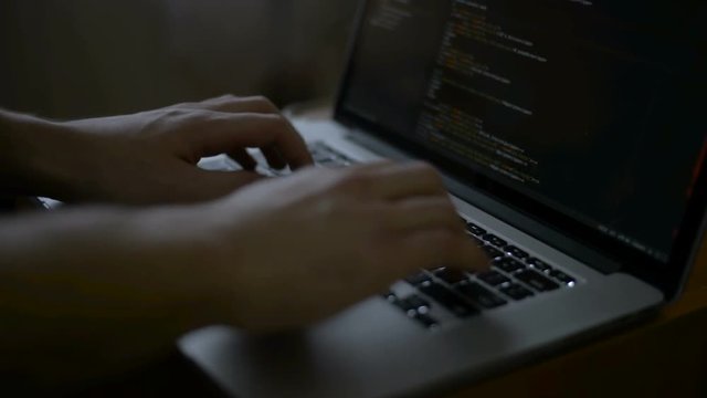 programmer from behind and programming code on computer monitor programming code is my own property there is no possible trademark or copyright infringement