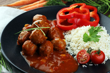 Delicious meatballs made from ground beef in a spicy tomato sauce