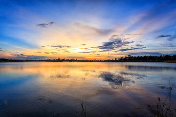 Fototapeta na wymiar Sunset with reflection on the lake