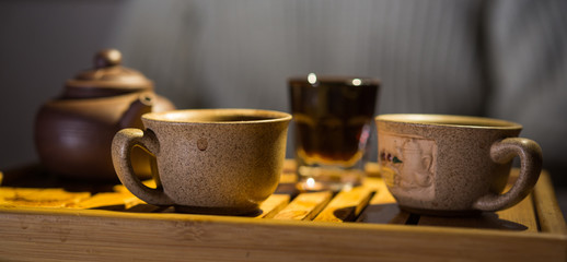 Tea drinking. Evening. Puer. Tea desk. Cups.