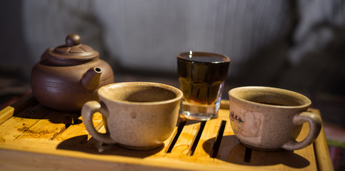 Tea drinking. Evening. Puer. Tea desk. Cups.