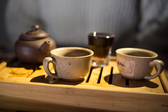 Tea drinking. Evening. Puer. Tea desk. Cups.