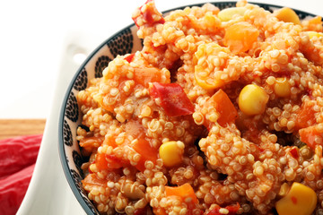 Delicious vegetarian quinoa salad with bell pepper, cucumber and tomatoes
