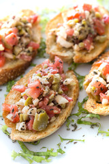 Bruschetta with roasted bell pepper,capers and basil