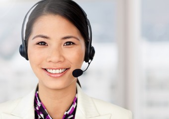 Woman wearing headphones at office