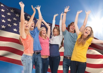 Obraz premium Group of young people cheering against American flag