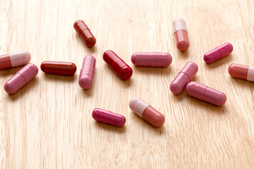 Pile from red medicine pills and capsules